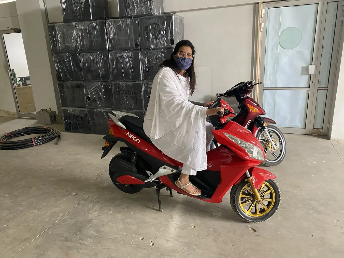 Trying an electric scooter as part of a women's transportation initiative